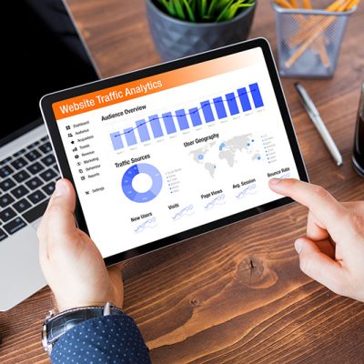 Website analytics and graphs open on tablet